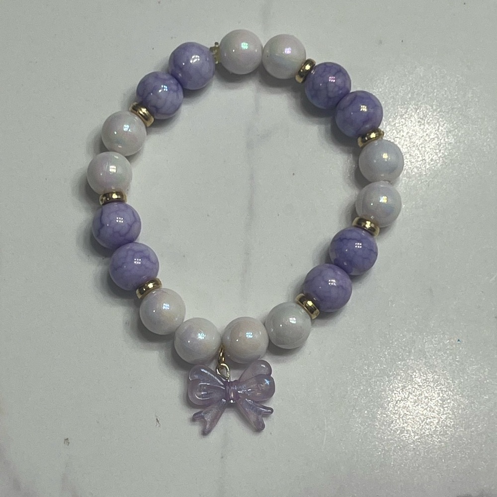 Purple and White Beaded Bracelet with Bow Charm